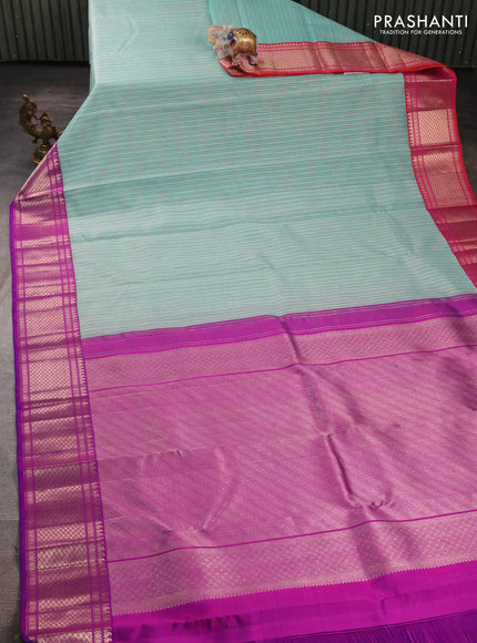 Kora kanchipuram silk saree teal blue and purple with allover silver & gold zari weaves and ganga jamuna border
