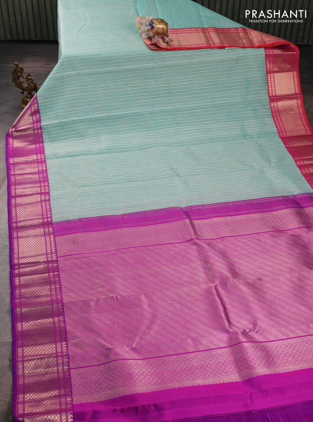 Kora kanchipuram silk saree teal blue and purple with allover silver & gold zari weaves and ganga jamuna border