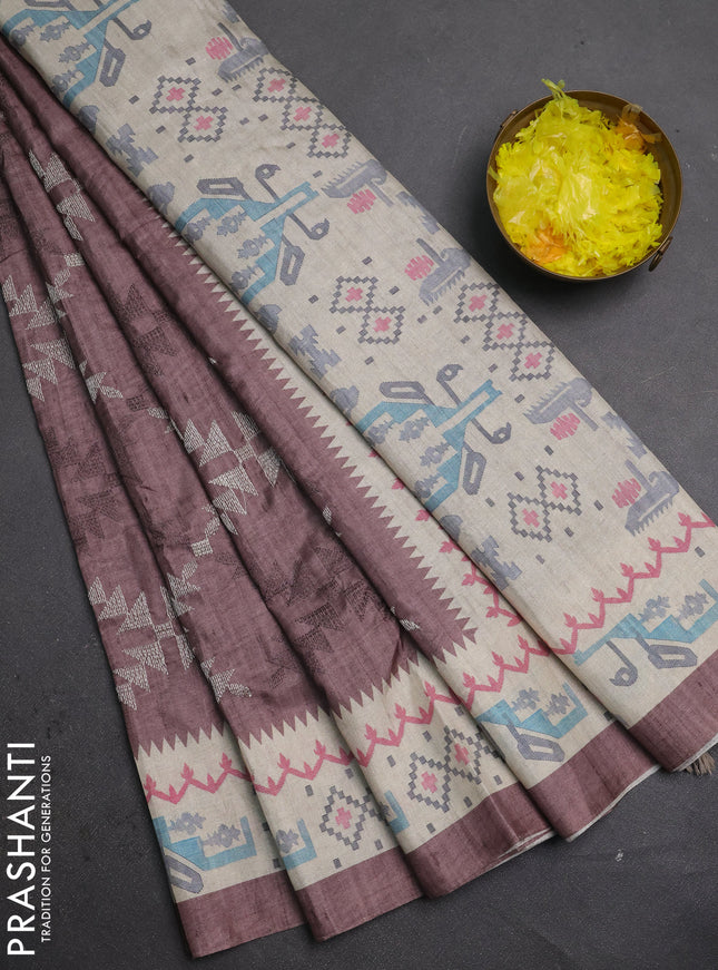 Art tussar saree pastel brown and cream with allover embroidery work and printed border