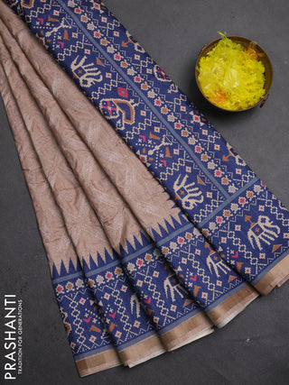 Art tussar saree beige and navy blue with allover embroidery work and patola printed border