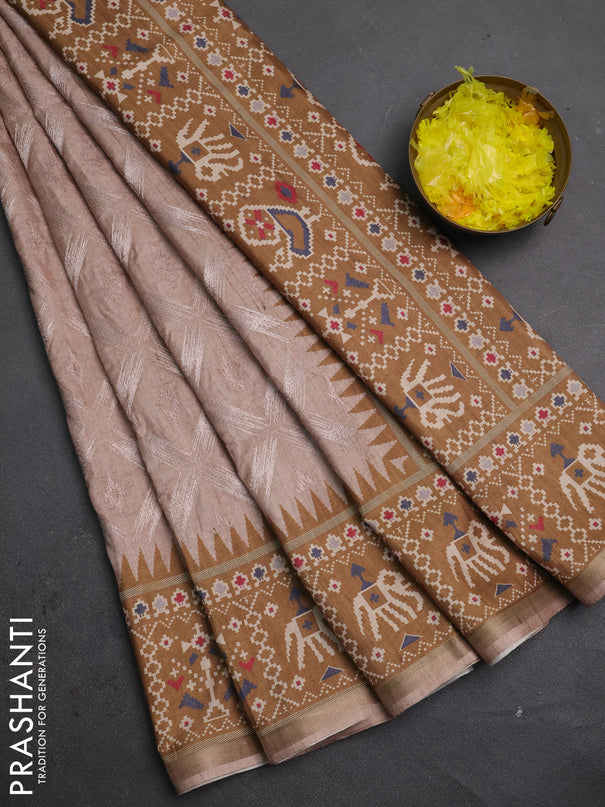 Art tussar saree beige and dark mustard with allover embroidery work and patola printed border