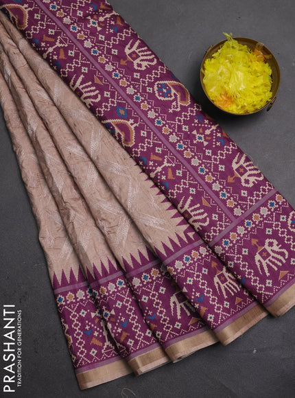 Art tussar saree beige and purple with allover embroidery work and patola printed border