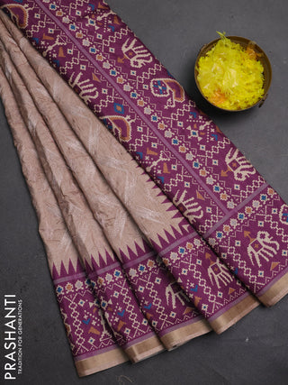 Art tussar saree beige and purple with allover embroidery work and patola printed border