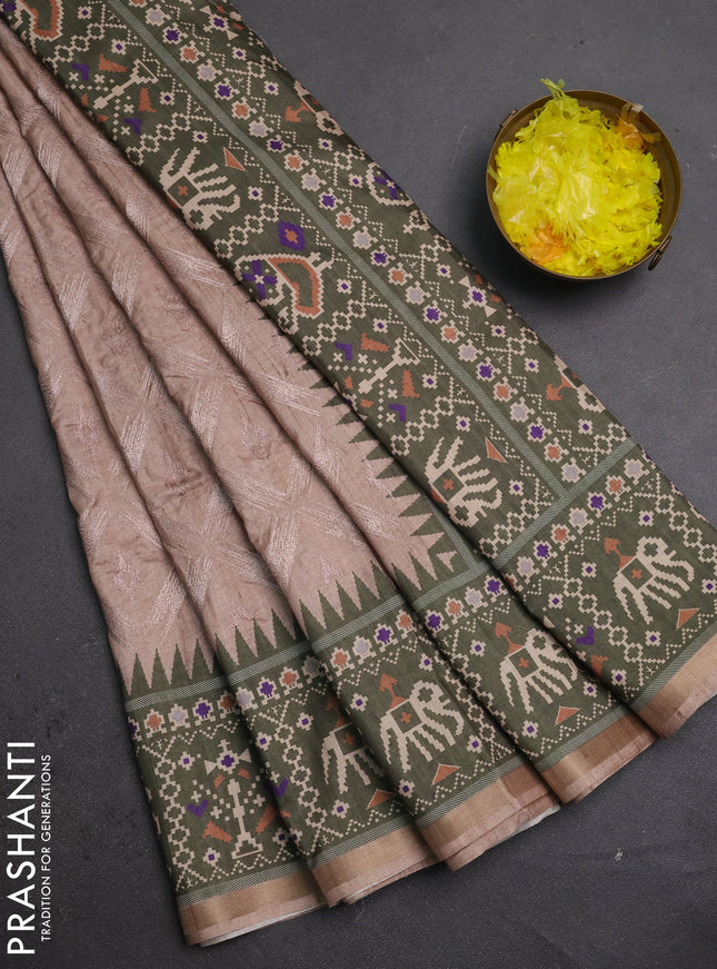 Art tussar saree beige and olive green with allover embroidery work and patola printed border