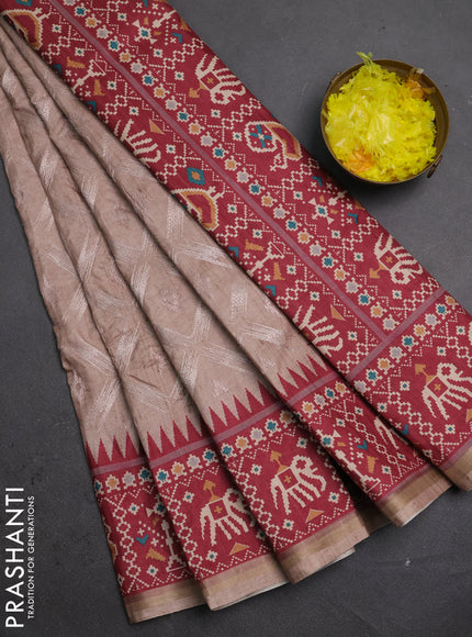 Art tussar saree beige and maroon with allover embroidery work and patola printed border