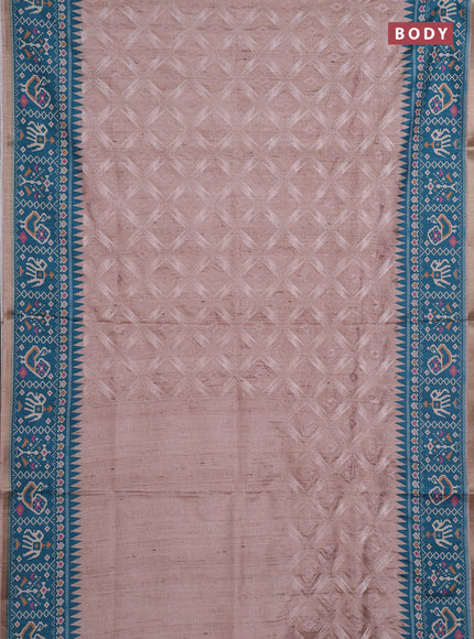 Art tussar saree beige and teal green with allover embroidery work and patola printed border