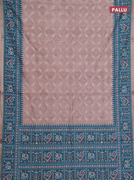Art tussar saree beige and teal green with allover embroidery work and patola printed border