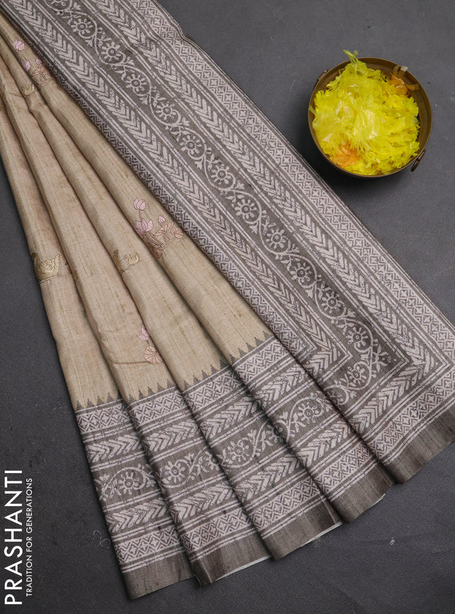 Art tussar saree beige and pastel green with allover embroidery buttas and long printed border