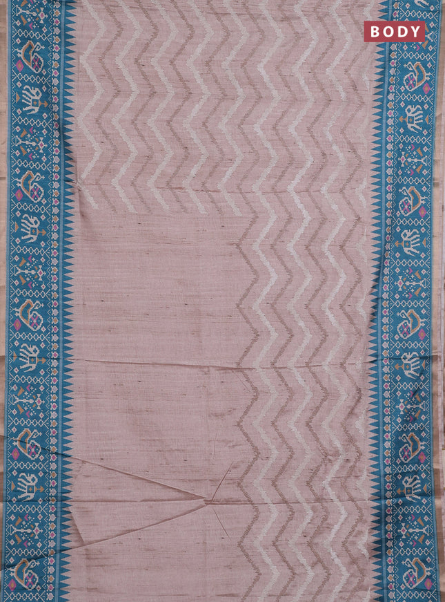 Art tussar saree beige and teal green shade with allover embroidery work and patola printed border
