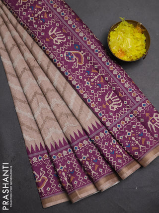 Art tussar saree beige and purple with allover embroidery work and patola printed border