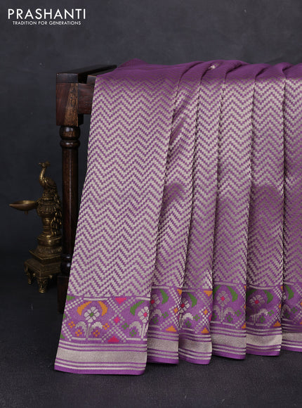 Banarasi raw silk saree lavender with allover silver zari woven brocade weaves and paithani style border