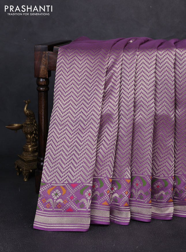 Banarasi raw silk saree lavender with allover silver zari woven brocade weaves and paithani style border
