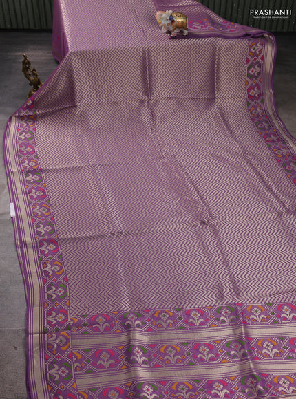 Banarasi raw silk saree lavender with allover silver zari woven brocade weaves and paithani style border