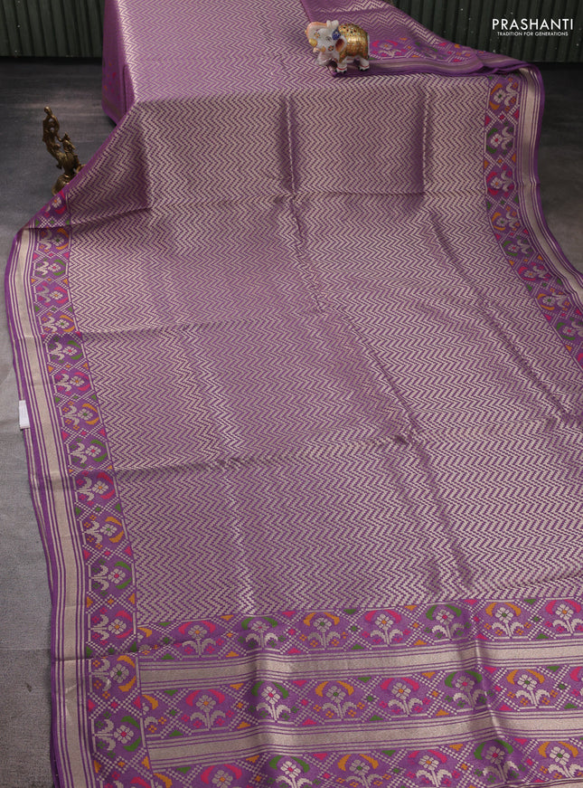 Banarasi raw silk saree lavender with allover silver zari woven brocade weaves and paithani style border
