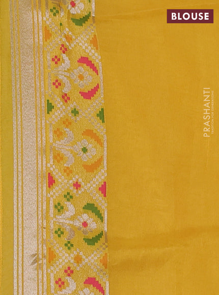 Banarasi raw silk saree yellow with allover silver zari woven brocade weaves and paithani style border