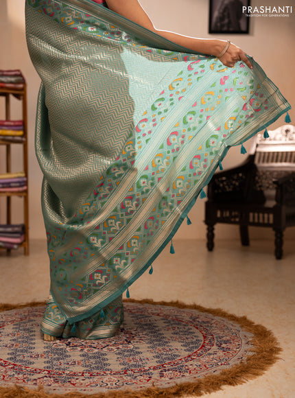 Banarasi raw silk saree teal green with allover silver zari woven brocade weaves and paithani style border