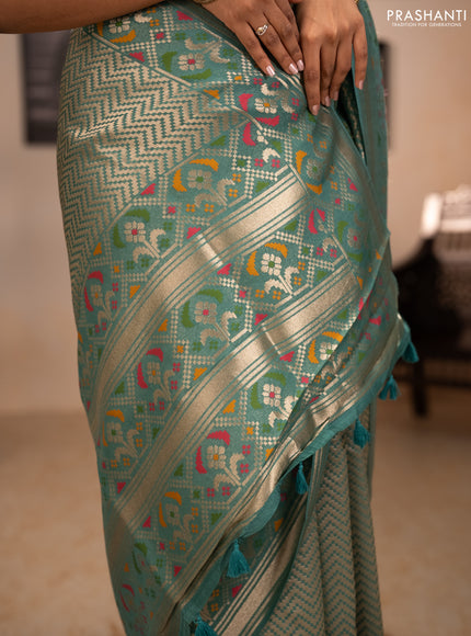 Banarasi raw silk saree teal green with allover silver zari woven brocade weaves and paithani style border