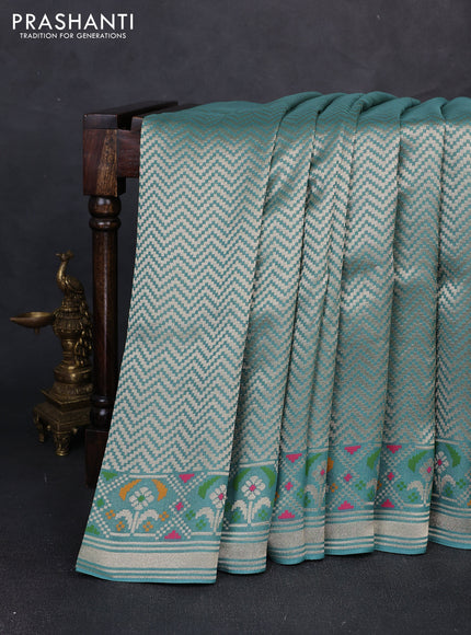 Banarasi raw silk saree teal green with allover silver zari woven brocade weaves and paithani style border