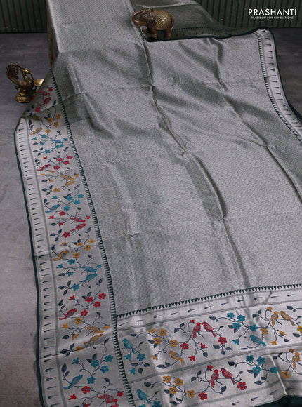 Banarasi raw silk saree bottle green with allover silver zari woven brocade weaves and paithani style border