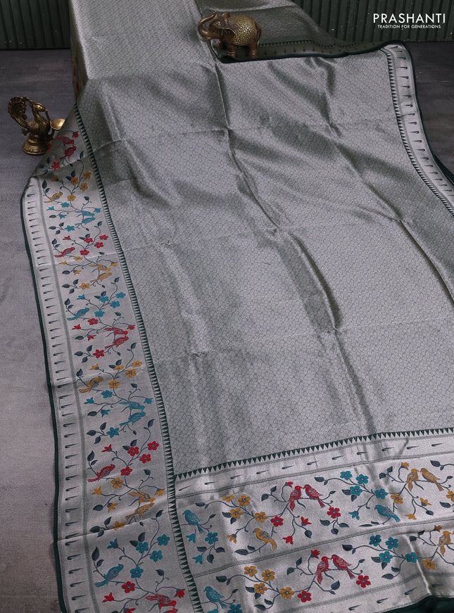 Banarasi raw silk saree bottle green with allover silver zari woven brocade weaves and paithani style border