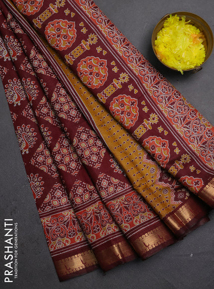 Semi maheshwari cotton saree maroon with allover ajrakh prints and zari woven muniya style border