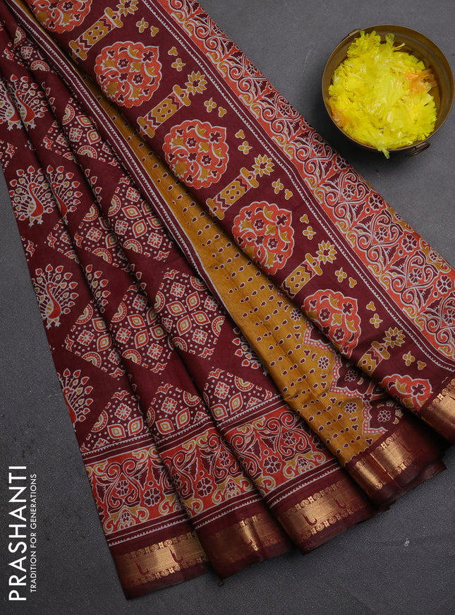 Semi maheshwari cotton saree maroon with allover ajrakh prints and zari woven muniya style border