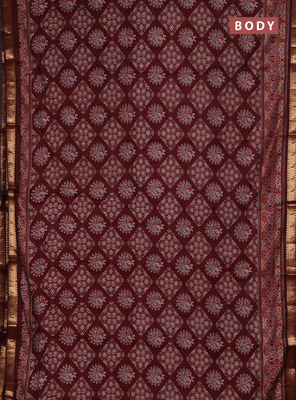Semi maheshwari cotton saree maroon with allover ajrakh prints and zari woven muniya style border