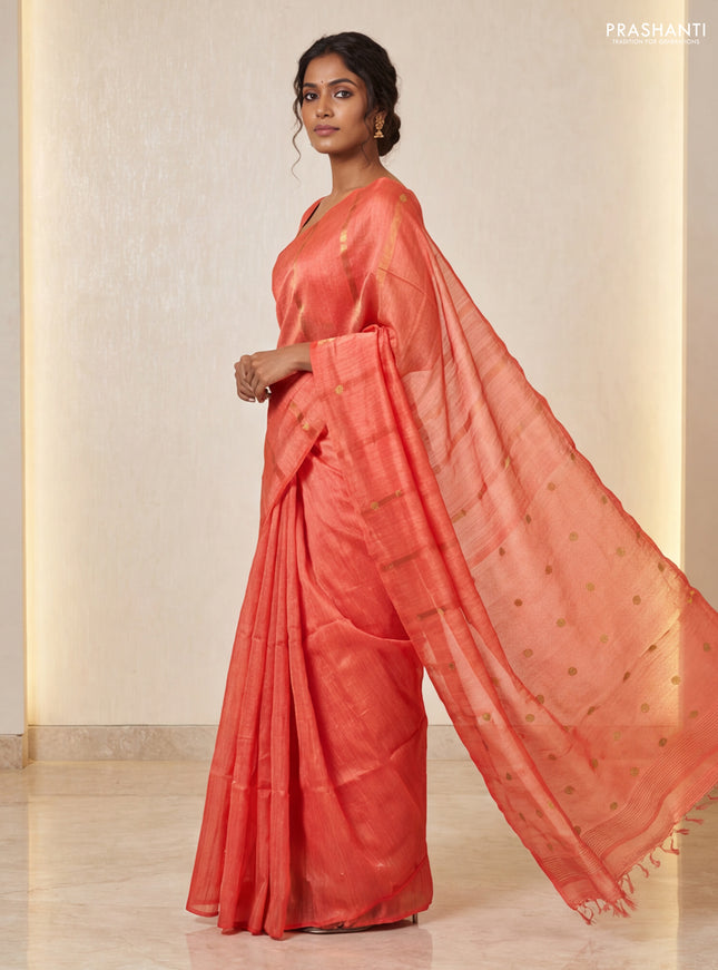Matka silk saree orange with allover coin buttas in borderless style