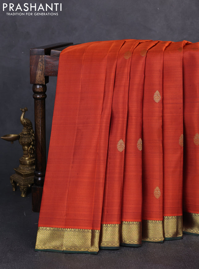 Pure kanchipuram silk saree rustic orange and bottle green with zari woven buttas and zari woven border