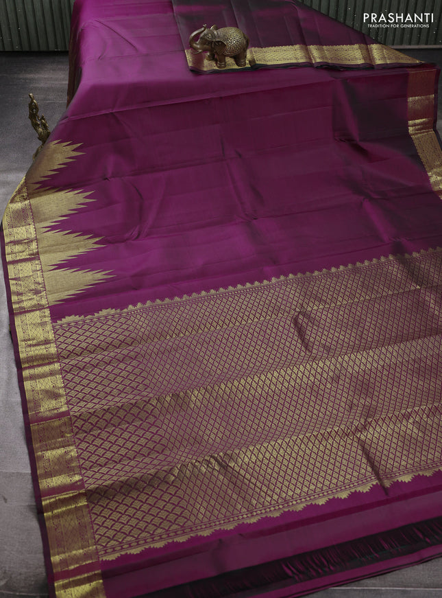 Pure kanchipuram silk saree deep wine shade with plain body and temple zari woven border
