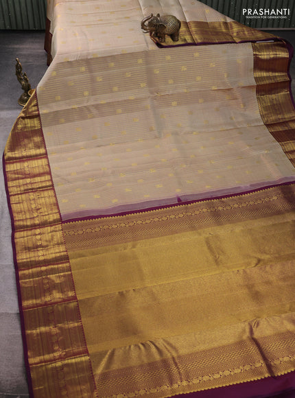 Pure kanchipuram silk saree beige and deep wine with allover zari small checks & buttas and zari woven border