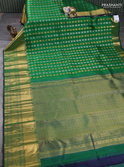 Pure kanchipuram silk saree green with allover silver zari woven buttas and long rich zari woven border
