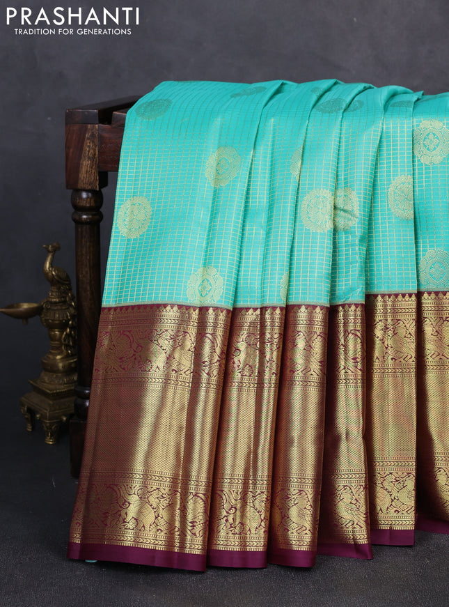 Pure kanchipuram silk saree teal green and wine shade with allover small zari checks & buttas and long zari woven border