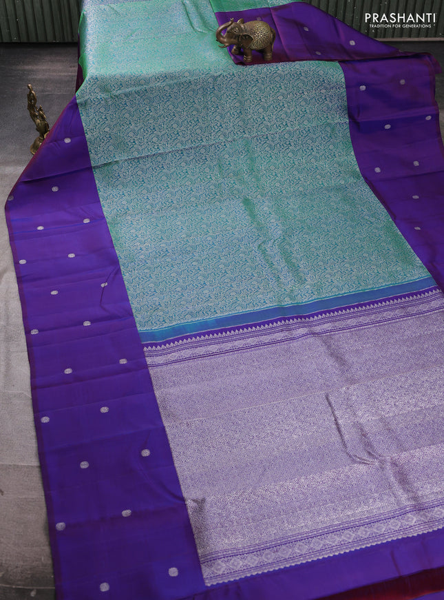 Pure kanchipuram silk saree teal green and blue with allover silver zari brocade weaves and silver zari woven butta border