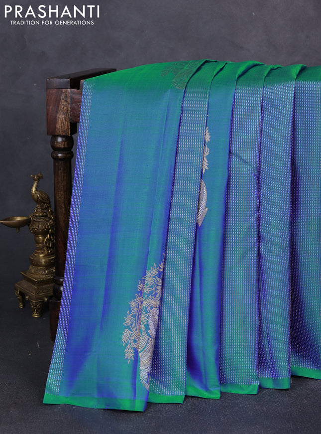 Pure kanchipuram silk saree dual shade of bluish green and purple with allover zari weaves & buttas in borderless style