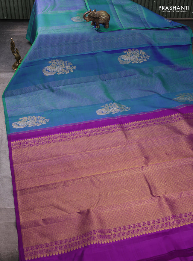 Pure kanchipuram silk saree dual shade of bluish green and purple with allover zari weaves & buttas in borderless style