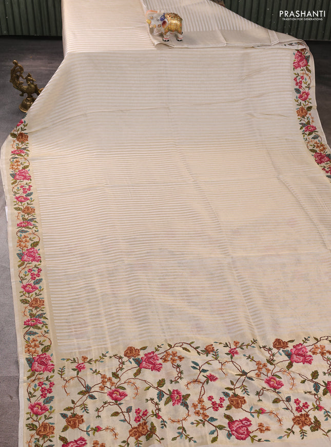 Tissue saree off white with allover zari stripe pattern and embroidery border
