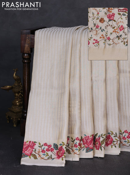 Tissue saree off white with allover zari stripe pattern and embroidery border