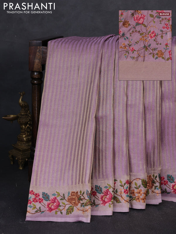 Tissue saree lavender with allover zari stripe pattern and embroidery border