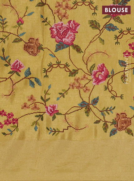 Tissue saree yellow with allover zari stripe pattern and embroidery border