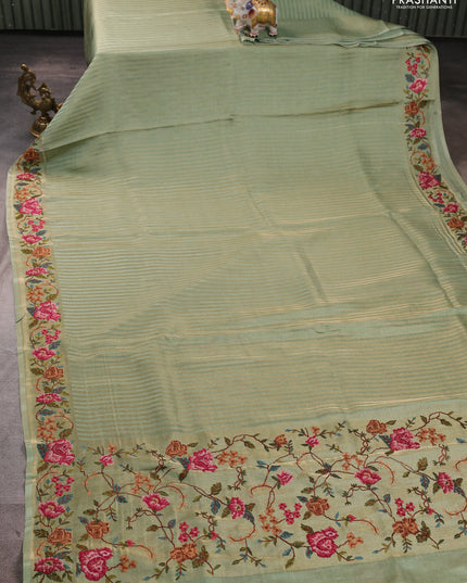Tissue saree pastel green with allover zari stripe pattern and embroidery border