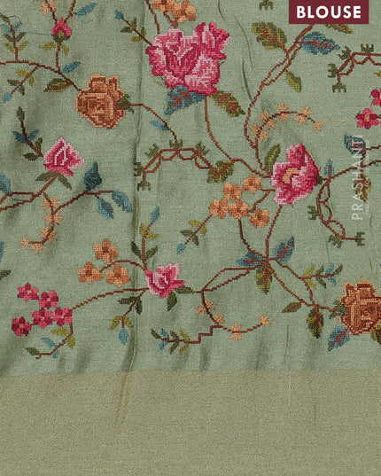 Tissue saree pastel green with allover zari stripe pattern and embroidery border