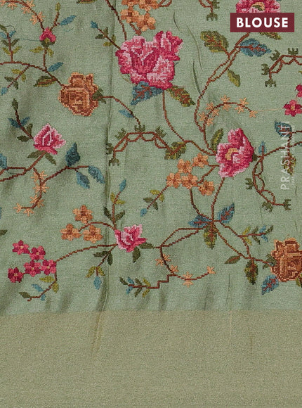 Tissue saree pastel green with allover zari stripe pattern and embroidery border