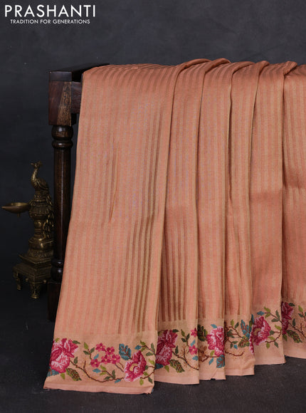 Tissue saree peach with allover zari stripe pattern and embroidery border