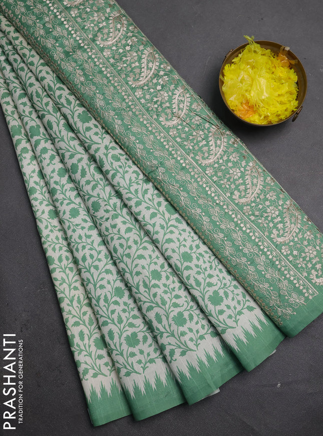 Art tussar saree cream and green with allover prints and embroidery pallu
