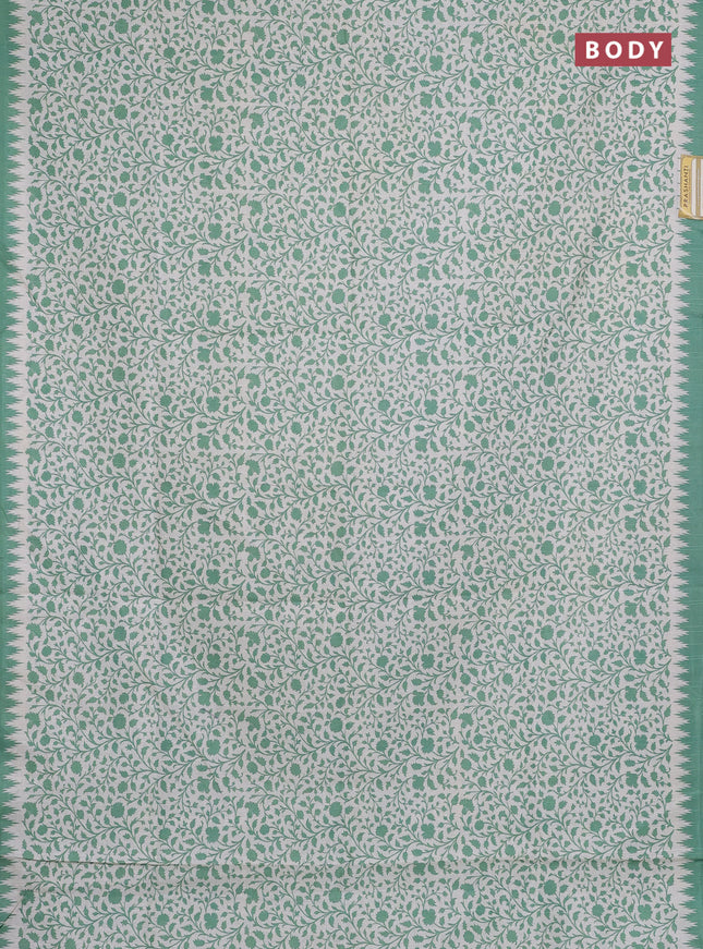 Art tussar saree cream and green with allover prints and embroidery pallu
