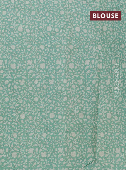 Art tussar saree cream and green with allover prints and embroidery pallu