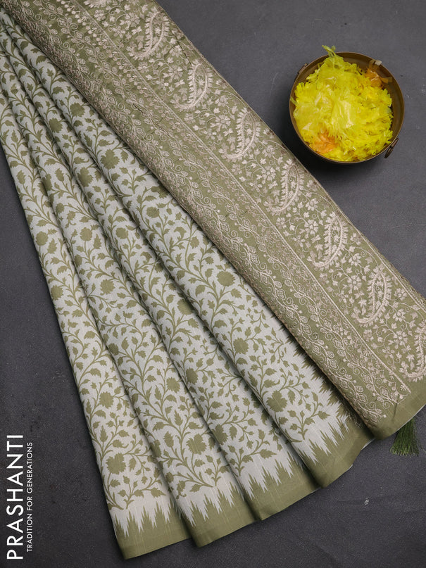 Art tussar saree cream and mehendi green with allover prints and embroidery pallu