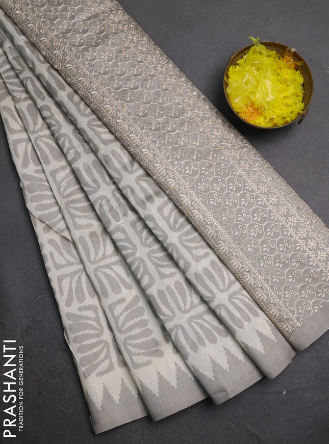 Art tussar saree cream and grey with allover ikat prints and embroidery pallu