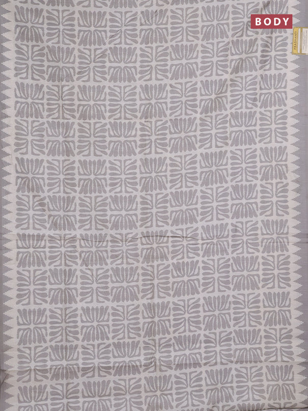 Art tussar saree cream and grey with allover ikat prints and embroidery pallu
